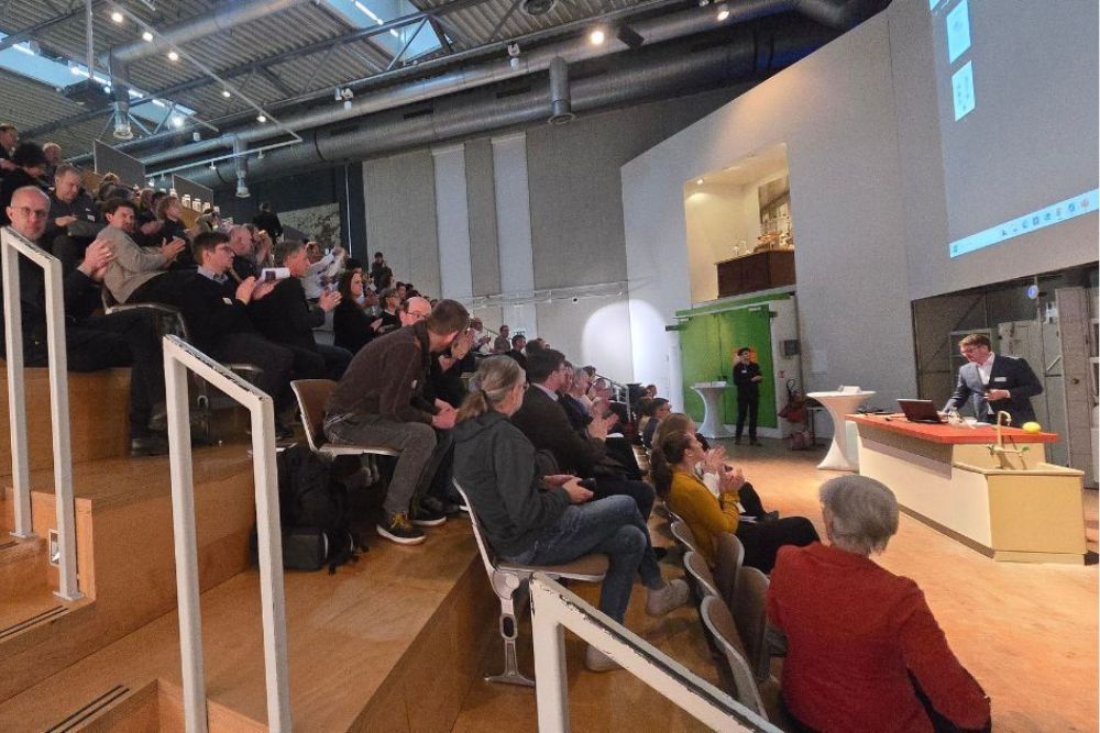 Photo: Participants listening to presentations at the AI Workshop 2026 in a lecture hall